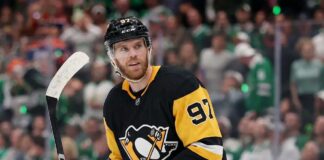 Edmonton Oilers captain Connor McDavid looking focused on the ice amidst intense Pittsburgh Penguins trade rumors.