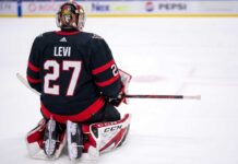 A conceptual visualization of goalie Devon Levi wearing an Ottawa Senators black home uniform with number 27, kneeling on the ice amidst NHL trade rumors linking the netminder to Ottawa.