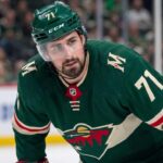 Minnesota Wild Trade Rumors: Detroit Red Wings Center Dylan Larkin Close-up photo of Detroit Red Wings center and captain Dylan Larkin, wearing jersey #71 in a Minnesota Wild uniform, who is the subject of Minnesota Wild NHL trade rumors to fill their top-line center role.