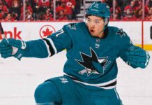 An image of Jason Robertson, wearing a teal San Jose Sharks jersey with number 71, celebrating a goal on the ice. This photo visually depicts the blockbuster trade rumor scenario.