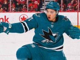 An image of Jason Robertson, wearing a teal San Jose Sharks jersey with number 71, celebrating a goal on the ice. This photo visually depicts the blockbuster trade rumor scenario.