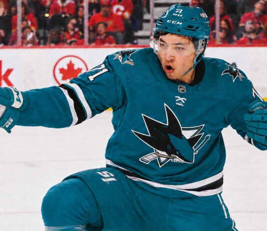 An image of Jason Robertson, wearing a teal San Jose Sharks jersey with number 71, celebrating a goal on the ice. This photo visually depicts the blockbuster trade rumor scenario.
