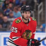 Chicago Blackhawks Trade Rumors: Will They Acquire Jordan Kyrou? NHL player Jordan Kyrou wearing a Chicago Blackhawks red jersey and helmet on the ice, visualizing trade rumors connecting him to Chicago.