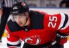 A visualization of trade rumors: St. Louis Blues forward Jordan Kyrou pictured in a New Jersey Devils jersey, skating at the Prudential Center.