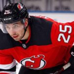A visualization of trade rumors: St. Louis Blues forward Jordan Kyrou pictured in a New Jersey Devils jersey, skating at the Prudential Center.