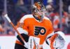 Concept photo of Toronto Maple Leafs goaltender Joseph Woll wearing a Philadelphia Flyers uniform and custom mask, illustrating the proposed trade rumors.