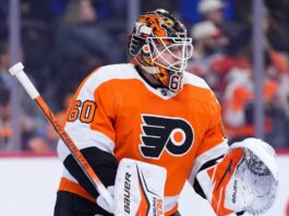 Joseph Woll Trade Rumors: Philadelphia Flyers Target Toronto Maple Leafs Goalie Concept photo of Toronto Maple Leafs goaltender Joseph Woll wearing a Philadelphia Flyers uniform and custom mask, illustrating the proposed trade rumors.
