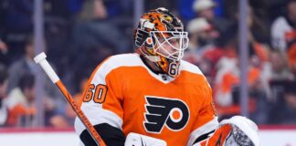 Concept photo of Toronto Maple Leafs goaltender Joseph Woll wearing a Philadelphia Flyers uniform and custom mask, illustrating the proposed trade rumors.