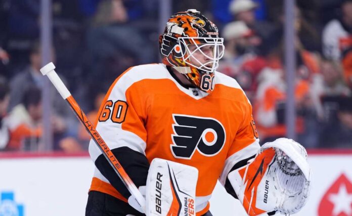 joseph-woll-toronto-maple-leafs-philadelphia-flyers-trade Concept photo of Toronto Maple Leafs goaltender Joseph Woll wearing a Philadelphia Flyers uniform and custom mask, illustrating the proposed trade rumors.