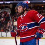 Anaheim Ducks center Mason McTavish on the ice wearing a Montreal Canadiens home jersey, fueling trade rumors about him becoming the Habs' new second-line center.