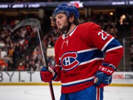 Anaheim Ducks center Mason McTavish on the ice wearing a Montreal Canadiens home jersey, fueling trade rumors about him becoming the Habs' new second-line center.