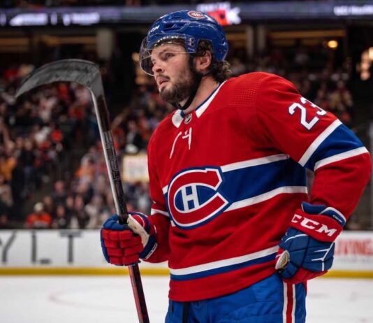 Anaheim Ducks center Mason McTavish on the ice wearing a Montreal Canadiens home jersey, fueling trade rumors about him becoming the Habs' new second-line center.
