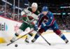 Cale Makar of the Colorado Avalanche and Kirill Kaprizov of the Minnesota Wild battle for the puck during Game 2 of their 2026 NHL playoff series.