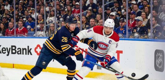 Watch Nick Suzuki and Rasmus Dahlin battle for the puck in the Montreal Canadiens vs. Buffalo Sabres playoff game on May 6, 2026.