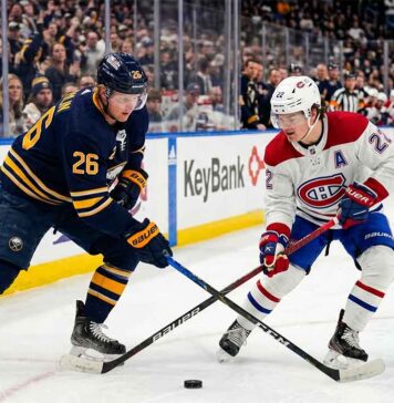 How to Watch Montreal Canadiens vs Buffalo Sabres Game 5 Tonight Montreal Canadiens Cole Caufield battles Buffalo Sabres Rasmus Dahlin for a loose puck during 2026 NHL Playoffs action at KeyBank Center.