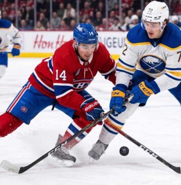ction shot from the 2026 NHL Playoffs showing Montreal Canadiens forward Nick Suzuki (#14) battling for the puck with a stick check against Buffalo Sabres forward Tage Thompson (#72) during an intense game.