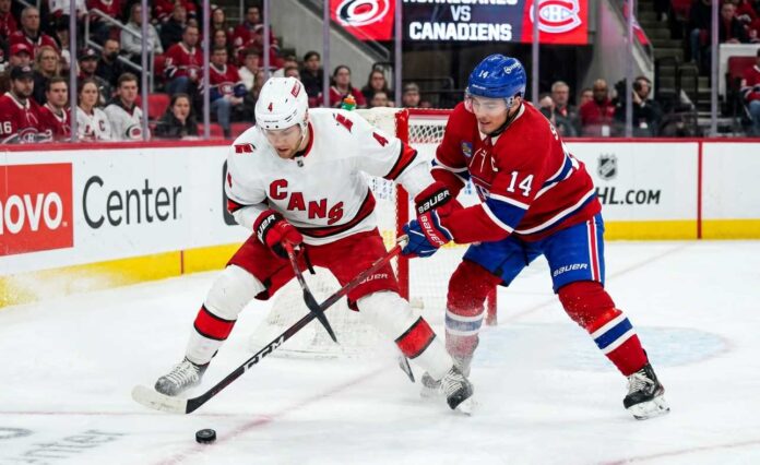 Carolina Hurricanes vs. Montreal Canadiens Game 5 (May 29, 2026): Key Playoff Moments - Nick Suzuki and Taylor Hall Battling for the Puck