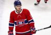 Montreal Canadiens Linked to New Jersey Devils’ Nico Hischier A conceptual jersey swap photograph featuring Nico Hischier on the ice wearing a red Montreal Canadiens home uniform, holding a stick, with number 13 on his blue CCM helmet.