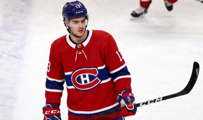A conceptual jersey swap photograph featuring Nico Hischier on the ice wearing a red Montreal Canadiens home uniform, holding a stick, with number 13 on his blue CCM helmet.