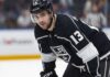 Nico Hischier Trade Rumors: Los Angeles Kings & New Jersey Devils Speculative photo of New Jersey Devils captain Nico Hischier wearing a black Los Angeles Kings home uniform amidst NHL trade rumors.