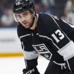 Nico Hischier Trade Rumors: Los Angeles Kings & New Jersey Devils Speculative photo of New Jersey Devils captain Nico Hischier wearing a black Los Angeles Kings home uniform amidst NHL trade rumors.