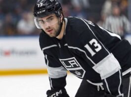 Nico Hischier Trade Rumors: Los Angeles Kings & New Jersey Devils Speculative photo of New Jersey Devils captain Nico Hischier wearing a black Los Angeles Kings home uniform amidst NHL trade rumors.
