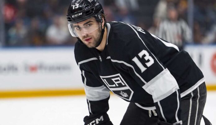 nico-hischier-new-jersey-devils-los-angeles-kings-trade Speculative photo of New Jersey Devils captain Nico Hischier wearing a black Los Angeles Kings home uniform amidst NHL trade rumors.