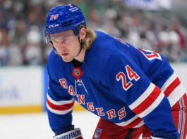 Roope Hintz in a New York Rangers home uniform as analyzed in Dallas Stars trade rumors.
