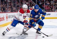 Buffalo Sabres vs. Canadiens Game 3: TV Schedule, Odds & Playoff Predictions Montreal Canadiens captain Nick Suzuki (14, white jersey) and Buffalo Sabres alternate captain Rasmus Dahlin (26, blue jersey) battling for the puck on the ice at Centre Bell during Game 3 of the 2026 NHL Playoffs.