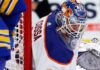 Edmonton Oilers Trade Rumor: Sebastian Cossa From Detroit Red Wings? NHL goaltender Sebastian Cossa pictured in fictional Edmonton Oilers uniform and custom orange and blue goalie mask, visualizing recent trade rumors.