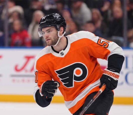 Philadelphia Flyers Trade Rumors: Targeting Shane Wright from Seattle Kraken NHL center Shane Wright pictured wearing a Philadelphia Flyers orange home jersey, illustrating potential NHL trade rumors connecting the Seattle Kraken forward to Philadelphia.