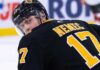 Simon Nemec looking back over his shoulder wearing a black Boston Bruins home jersey with number 17, illustrating NHL trade rumors linking him to Boston.