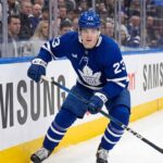 Toronto Maple Leafs forward Matthew Knies, wearing jersey number 23, skating on the ice during an NHL game. This image relates to offseason trade rumors regarding Knies and his perceived high value in the NHL trade market.