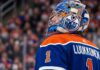 Edmonton Oilers Trade Rumors: Ukka-Pekka Luukkonen Sabres Deal A close-up profile view of Buffalo Sabres goaltender Ukko-Pekka Luukkonen, wearing his custom-painted goalie mask and blue jersey with 'LUUKKONEN' visible on the back. This image is used in an analysis of a potential trade linking him to the Edmonton Oilers.