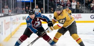 How to Watch Vegas Golden Knights vs Colorado Avalanche Game 2 Tonight An action shot of Nathan MacKinnon (#29) of the Colorado Avalanche battling Shea Theodore (#27) of the Vegas Golden Knights in a crucial playoff game face-off.