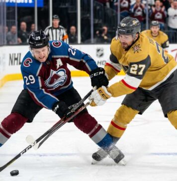How to Watch Vegas Golden Knights vs Colorado Avalanche Game 2 Tonight An action shot of Nathan MacKinnon (#29) of the Colorado Avalanche battling Shea Theodore (#27) of the Vegas Golden Knights in a crucial playoff game face-off.
