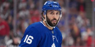 New York Rangers center Vincent Trocheck, number 16, in action on the ice, subject of intense trade rumors linking him to the Toronto Maple Leafs.
