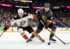 Anaheim Ducks and Vegas Golden Knights hockey players battle for the puck during Game 5 of the 2026 Western Conference Semi-Finals at T-Mobile Arena in Las Vegas.