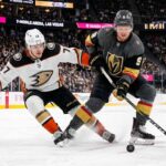 Anaheim Ducks and Vegas Golden Knights hockey players battle for the puck during Game 5 of the 2026 Western Conference Semi-Finals at T-Mobile Arena in Las Vegas.