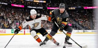 How to Watch Anaheim Ducks vs. Vegas Golden Knights Game 5 Tonight Anaheim Ducks and Vegas Golden Knights hockey players battle for the puck during Game 5 of the 2026 Western Conference Semi-Finals at T-Mobile Arena in Las Vegas.