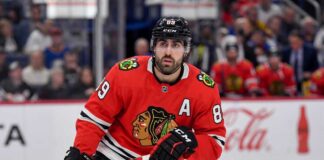 Chicago Blackhawks Free Agency: Why Alex Tuch is the Perfect Fit Speculative image projection of Alex Tuch in a Chicago Blackhawks red home jersey, an ideal NHL free agent target and potential new linemate for Connor Bedard.
