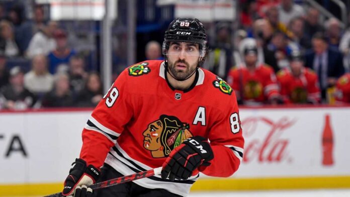 alex-tuch-chicago-blackhawks-target Speculative image projection of Alex Tuch in a Chicago Blackhawks red home jersey, an ideal NHL free agent target and potential new linemate for Connor Bedard.
