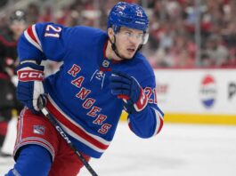Alexander Nikishin Rangers Trade Rumor: Why the Hurricanes Defenseman Fits New York Alexander Nikishin wearing a New York Rangers home jersey and helmet in trade rumor image after being linked to New York from the Carolina Hurricanes
