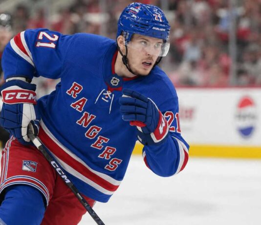 Alexander Nikishin Rangers Trade Rumor: Why the Hurricanes Defenseman Fits New York Alexander Nikishin wearing a New York Rangers home jersey and helmet in trade rumor image after being linked to New York from the Carolina Hurricanes