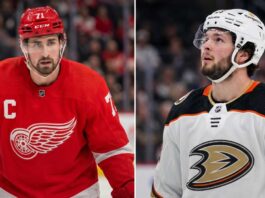 Anaheim Ducks Linked to Detroit Red Wings Captain Dylan Larkin in Blockbuster Rumor Split image featuring Detroit Red Wings captain Dylan Larkin in a red jersey and Anaheim Ducks young center Mason McTavish in a white jersey, illustrating the rumored NHL trade scenario.