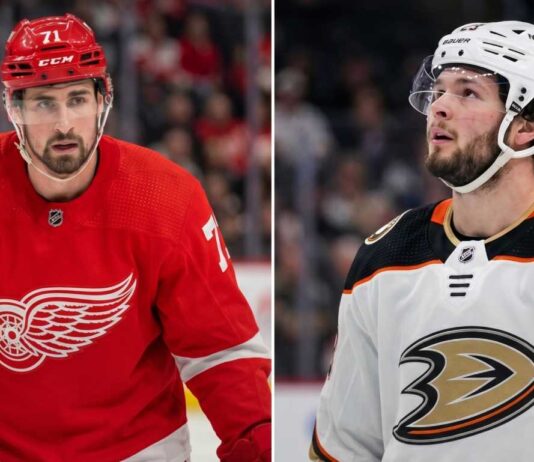 Anaheim Ducks Linked to Detroit Red Wings Captain Dylan Larkin in Blockbuster Rumor Split image featuring Detroit Red Wings captain Dylan Larkin in a red jersey and Anaheim Ducks young center Mason McTavish in a white jersey, illustrating the rumored NHL trade scenario.