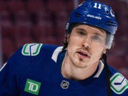 Brendan Gallagher Leaving Montreal Canadiens: Vancouver Canucks Rumors Conceptually rendered photo of former Montreal Canadiens winger Brendan Gallagher in a Vancouver Canucks home uniform, visualizing trade and buyout rumors.