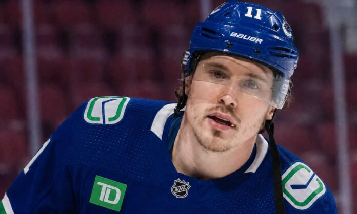 Conceptually rendered photo of former Montreal Canadiens winger Brendan Gallagher in a Vancouver Canucks home uniform, visualizing trade and buyout rumors.