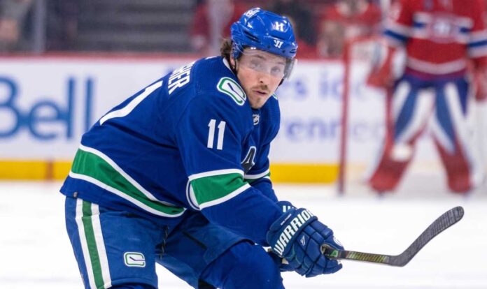 brendan-gallagher-vancouver-canucks-trade-rumor High-quality visualization of Brendan Gallagher wearing a Vancouver Canucks blue and green uniform on the ice, illustrating a rumored NHL trade from the Montreal Canadiens.