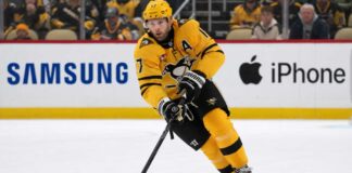 Pittsburgh Penguins Bryan Rust Trade Rumors & Updates A photo of Pittsburgh Penguins forward and alternate captain Bryan Rust skating with the hockey puck in the team's yellow and black uniform during a game.